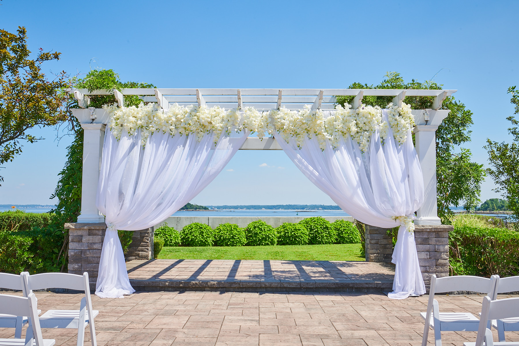 Wedding Ceremony under the pergola at Greentree Country Club