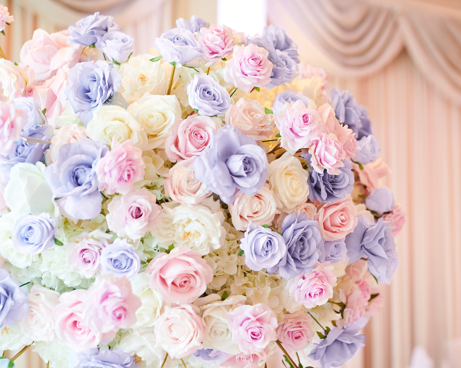 Image of a wedding flower arrangement inside Greentree Country Club